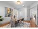 Well-lit office with a sleek desk, hardwood floors, and ample natural light from large windows at 1114 Georgia Blvd, Orlando, FL 32803