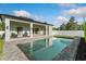 Backyard with a swimming pool, white fencing and a covered lanai perfect for entertaining at 1114 Georgia Blvd, Orlando, FL 32803