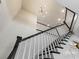 Elegant staircase featuring dark wood and white railings, with modern lighting fixtures at 1114 Georgia Blvd, Orlando, FL 32803