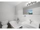 Clean bathroom featuring a clawfoot tub, vanity, and classic white tile, offering a relaxing space at 117 Exeter Ave, Longwood, FL 32750