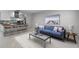 Living room showcasing the open floor plan, updated kitchen with barstool seating, and natural light at 117 Exeter Ave, Longwood, FL 32750