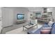 Open floor plan seamlessly connecting the living room, dining area, and kitchen with barstool seating at 117 Exeter Ave, Longwood, FL 32750