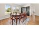 Dining room featuring a large table with seating for eight and a built-in display case at 118 White Birch Dr, Kissimmee, FL 34743
