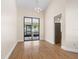 Well-lit dining area featuring sleek sliding doors and a modern light fixture at 118 White Birch Dr, Kissimmee, FL 34743