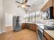 Spacious kitchen with wood cabinets, stainless steel appliances, a large window, and ample counter space at 118 White Birch Dr, Kissimmee, FL 34743