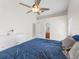 Comfortable main bedroom with fan and bathroom access at 118 White Birch Dr, Kissimmee, FL 34743
