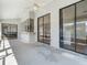 Covered patio with a ceiling fan, exterior windows, sliding glass doors, and a view of the backyard and pool area at 118 White Birch Dr, Kissimmee, FL 34743