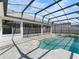 Backyard pool with screened enclosure at 118 White Birch Dr, Kissimmee, FL 34743