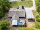 Aerial view of backyard showing the pool with screened enclosure at 1201 Groveland Dr, Chuluota, FL 32766