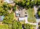 Aerial view of house featuring a screened pool and carport at 1201 Groveland Dr, Chuluota, FL 32766