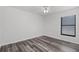 Bedroom with a ceiling fan and a window, offering a simple and comfortable space at 1201 Groveland Dr, Chuluota, FL 32766