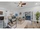 Bright and airy open floor plan with modern furnishings, seamless transition to outdoor living space at 1201 Groveland Dr, Chuluota, FL 32766