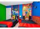 The bright bedroom features twin beds with Super Mario themed decor, creating a playful and fun atmosphere at 1293 Emerald Row, Clermont, FL 34714