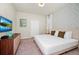 The bedroom is spacious and has a patterned accent wall, creating a cozy and inviting atmosphere at 1293 Emerald Row, Clermont, FL 34714