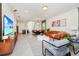 Open-concept living space with modern decor, seamlessly blending living and dining areas at 1293 Emerald Row, Clermont, FL 34714