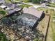 Aerial view of a fenced backyard featuring a screened in pool at 1296 Gage Ave, Deltona, FL 32738