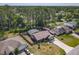 Aerial view of a single Gathering home featuring a fenced pool and extended driveway at 1296 Gage Ave, Deltona, FL 32738