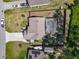 An aerial view of a single Gathering home featuring a fenced pool and extended driveway at 1296 Gage Ave, Deltona, FL 32738