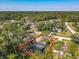 Aerial view of a single Gathering home featuring a fenced pool and extended driveway at 1296 Gage Ave, Deltona, FL 32738