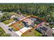 Aerial view of a single Gathering home featuring a fenced pool and extended driveway at 1296 Gage Ave, Deltona, FL 32738