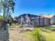 Spacious backyard featuring a screened pool enclosure and lush green lawn at 1296 Gage Ave, Deltona, FL 32738