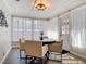 Cozy dining area with modern lighting, seating for four, and lots of natural light at 1296 Gage Ave, Deltona, FL 32738