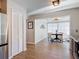 View of the formal dining room with floor to ceiling windows and access to the kitchen at 1296 Gage Ave, Deltona, FL 32738