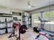This home gym has weights, workout equipment, and treadmill for exercise at 1296 Gage Ave, Deltona, FL 32738