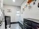This is a laundry room or mud room with a washer and dryer combo and chest of drawers at 1296 Gage Ave, Deltona, FL 32738