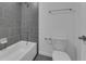 Bathroom includes a tub/shower with gray tiling at 1343 Wood Line Dr, Deland, FL 32720