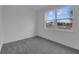 Cozy bedroom with a large window offering natural light and neighborhood views at 1343 Wood Line Dr, Deland, FL 32720