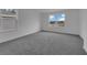 Bright bedroom with a window offering neighborhood views and ample natural light at 1343 Wood Line Dr, Deland, FL 32720