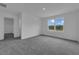 Bright bedroom with a window view and neutral carpet at 1343 Wood Line Dr, Deland, FL 32720