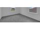 Empty bedroom with two windows at 1343 Wood Line Dr, Deland, FL 32720