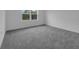 Cozy carpeted bedroom with a bright window and natural light at 1343 Wood Line Dr, Deland, FL 32720