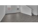 Bright living room with gray wood-look flooring and stairs to the upper floor at 1343 Wood Line Dr, Deland, FL 32720