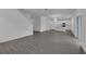 Spacious living room featuring open floor plan and gray wood-look flooring at 1343 Wood Line Dr, Deland, FL 32720