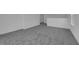 Spacious loft area with neutral carpet, ready for recreation or relaxation at 1343 Wood Line Dr, Deland, FL 32720