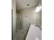 Clean bathroom showcasing a walk-in shower with glass door and spacious vanity area at 14143 Title Way, Winter Garden, FL 34787
