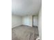 A neutral-toned bedroom with a standard closet and carpeted flooring at 14143 Title Way, Winter Garden, FL 34787