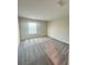 A sunlit bedroom includes a carpeted floor, blinds, and ample natural light at 14143 Title Way, Winter Garden, FL 34787