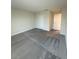 A bedroom includes a carpeted floor, white doors, and a neutral-colored walls at 14143 Title Way, Winter Garden, FL 34787