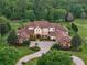 Stunning estate home featuring lush landscaping, grand entrance, and a sprawling tree-lined property at 1526 Bluewater Run, Chuluota, FL 32766