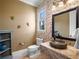 Unique bathroom featuring decorative wall accents, a stone sink, and a modern toilet at 1526 Bluewater Run, Chuluota, FL 32766