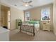 Comfortable bedroom features neutral tones, natural lighting, and an open doorway to the bathroom at 1526 Bluewater Run, Chuluota, FL 32766