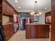 Spacious walk-in closet with custom cabinets, shelves, and an island with stone countertop at 1526 Bluewater Run, Chuluota, FL 32766