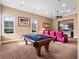 Game room with pool table, comfortable seating and windows offering natural light and outdoor views at 1526 Bluewater Run, Chuluota, FL 32766