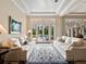 Comfortable living area with French doors to the backyard pool and tile floors at 1526 Bluewater Run, Chuluota, FL 32766