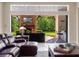 Outdoor living area with fireplace, television, outdoor bar, and comfortable seating at 1526 Bluewater Run, Chuluota, FL 32766