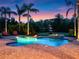 Inviting swimming pool with a water feature, surrounded by tropical landscaping, perfect for relaxation at 1526 Bluewater Run, Chuluota, FL 32766